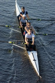 Men's coxless four rowing under Newburn bridge setting a fantastic time